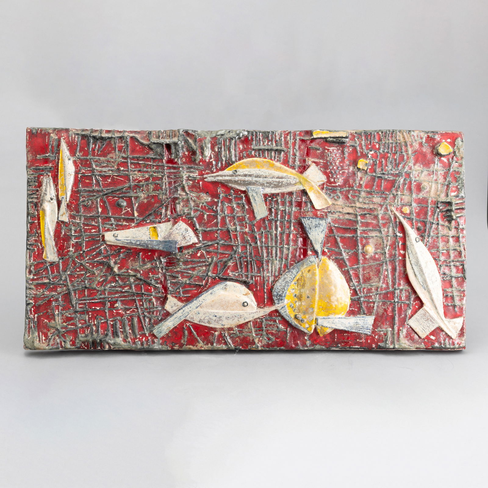 Carlo Zauli 1926-2002 C. Zauli, Faenza 1950 ca: A majolica-tiled terracotta plaque with an embossed abstract marine decor. Author's signature, cm 36x71,5