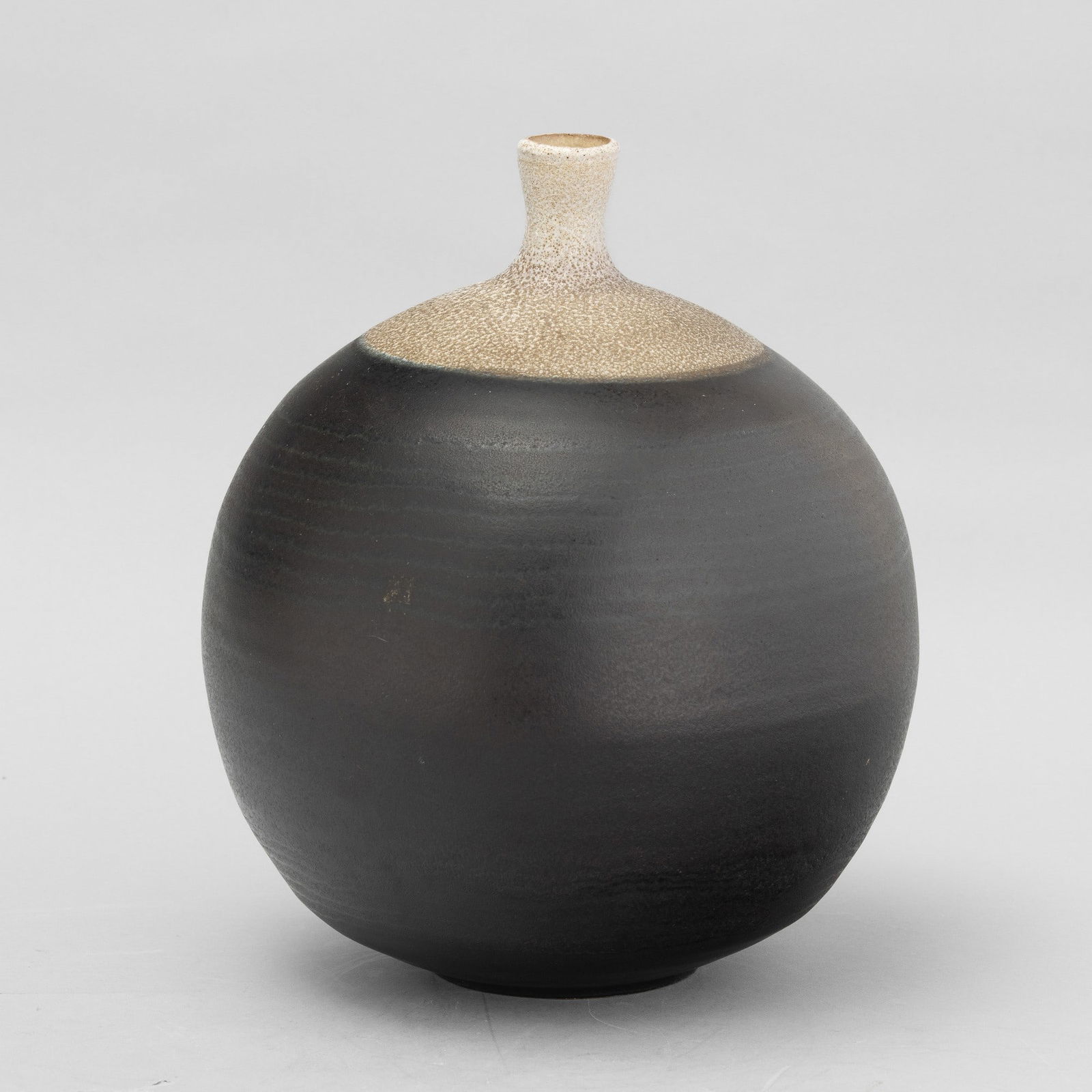 Carlo Zauli 1926-2002 C. Zauli, Faenza 1960 ca: A grès vase with a two-tone band decor. Author's signature, altezza cm 29 diametro cm 22