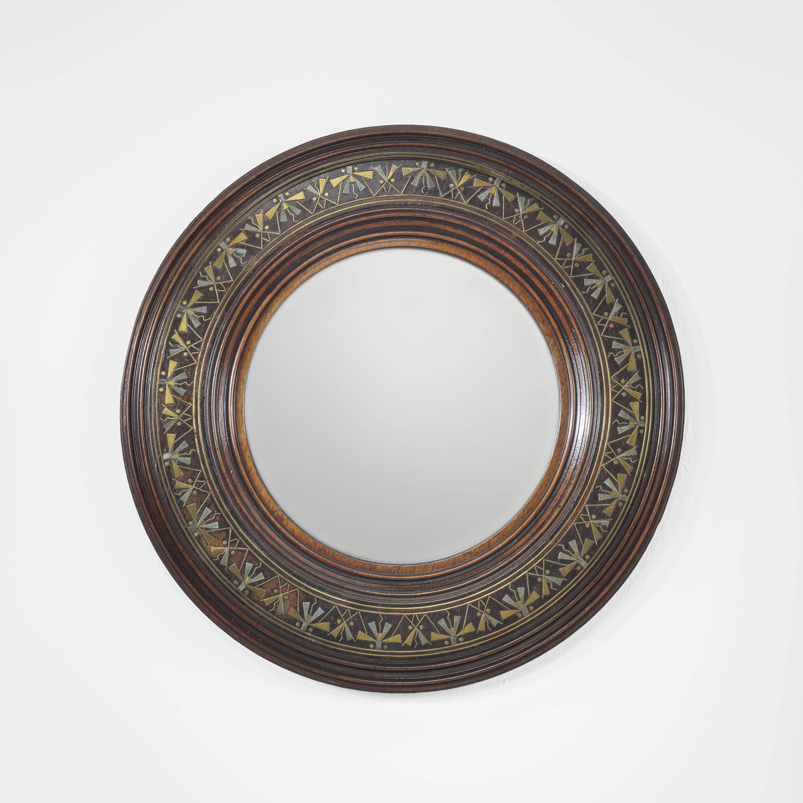 Carlo Bugatti Mirror: Wooden frame, ebony wood. Metal and brass inlays. Bugatti, Italy, c. 1900. Carlo Bugatti's arrival at the design of exotic furniture was not linear or immediate. Following in his father's footsteps, i