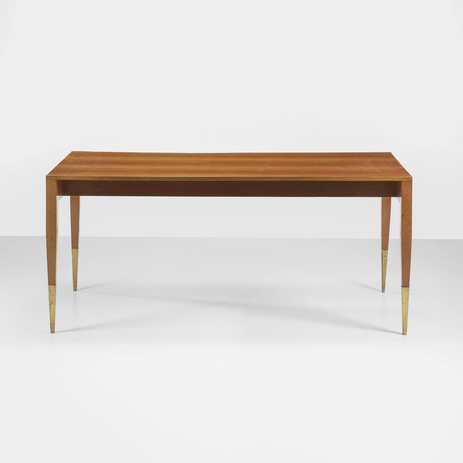 Gio Ponti Table: Wooden top and structure. Brass details. Certificate of authenticity Gio Ponti Archives. Italy, c. 1950.