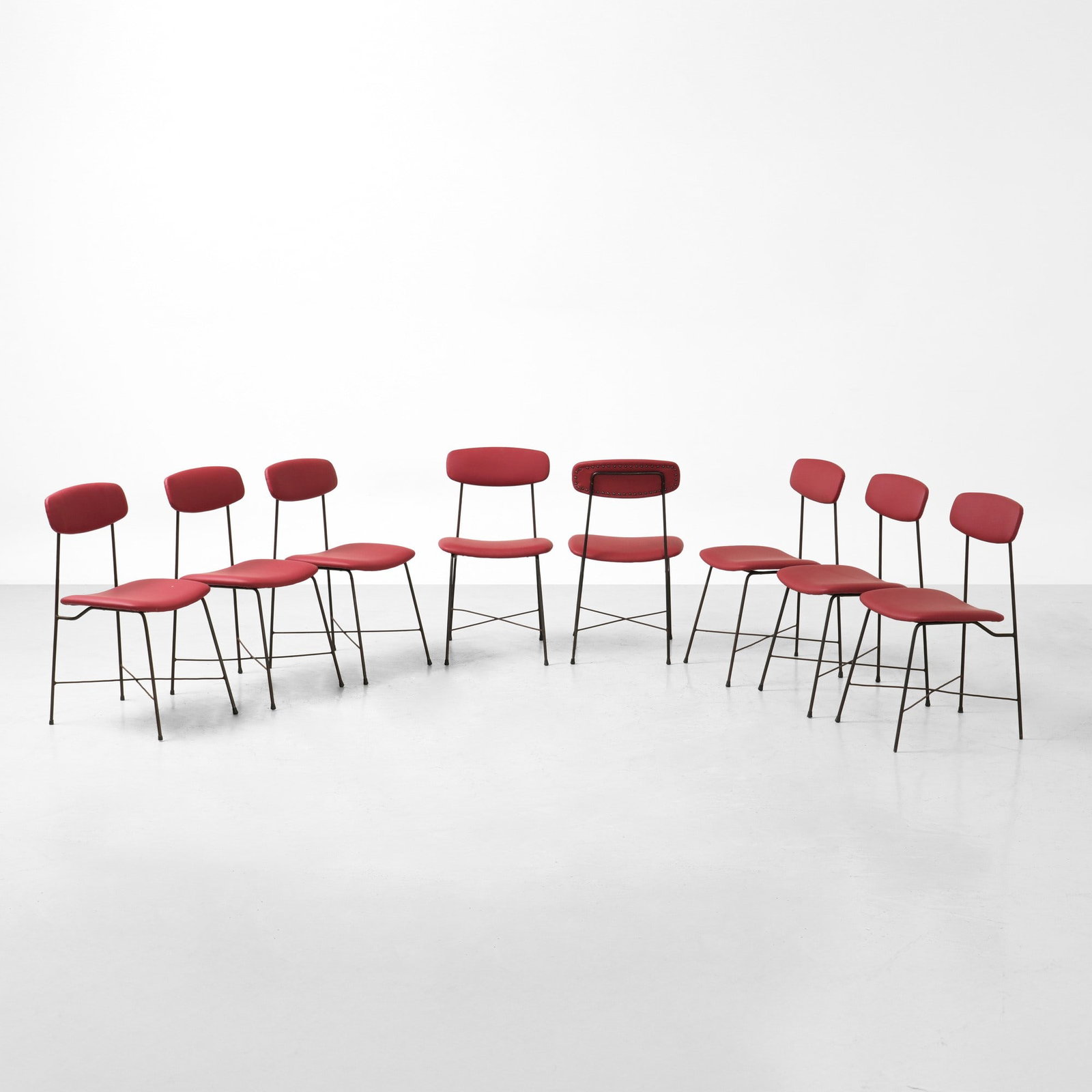 Georges Coslin Otto sedie: Struttura in metallo tubolare laccato e rivestimento in skai. Prod. Faram, Italia, 1950 ca.