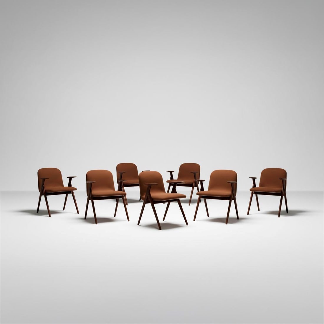 Otto poltrone: Struttura in legno con rivestimento in tessuto. Prod. Italia, 1960 ca.