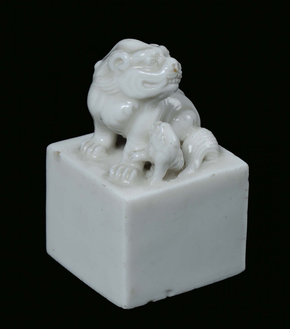 A Blanc de Chine porcelain seal with Pho dog and puppet