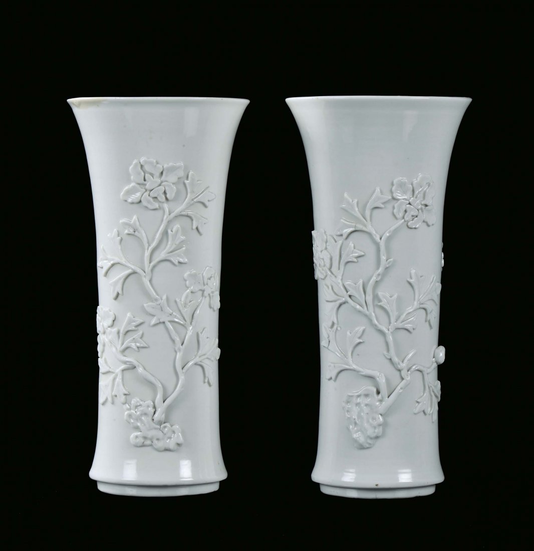 Pair of Blanc de Chine porcelain trumpet vase with reli