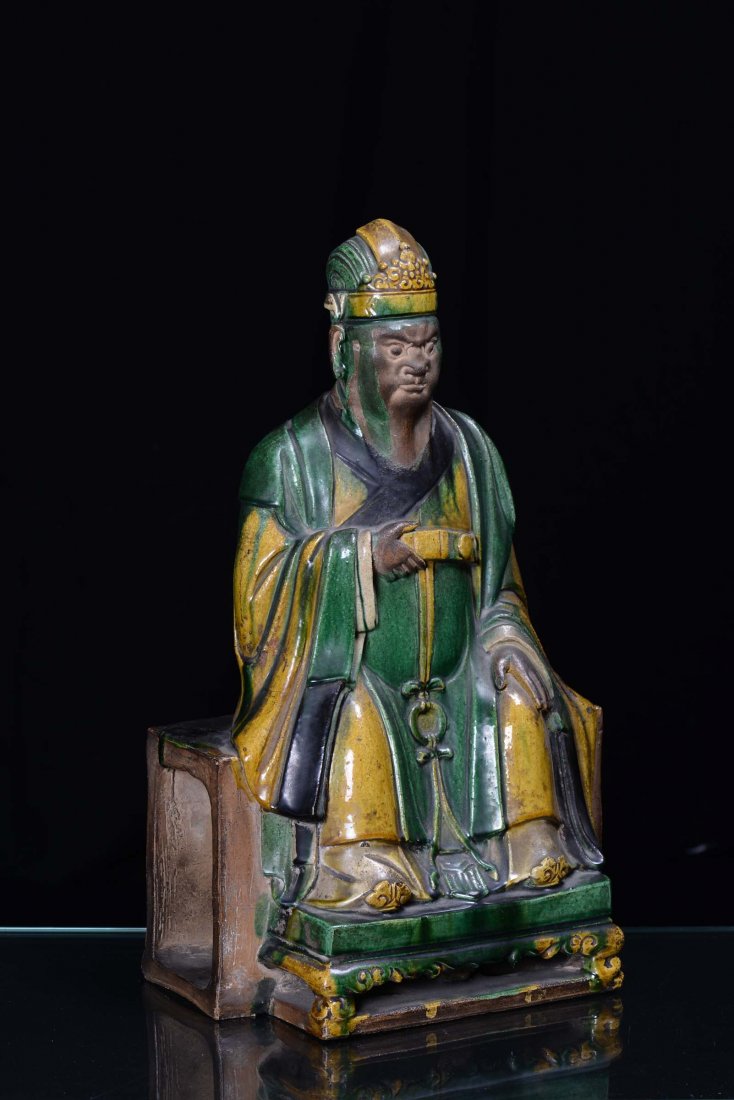 A large enamelled stoneware sitting Dignitary figure, C - 4
