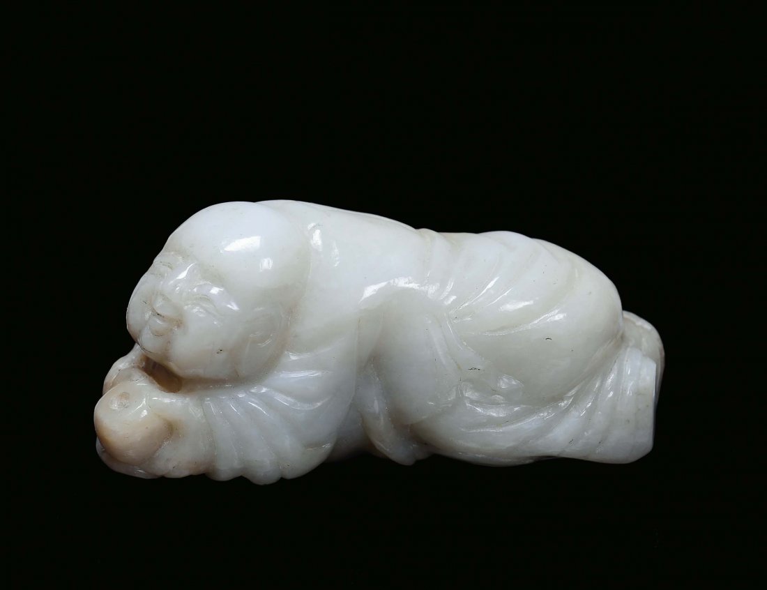 A small jade lying down oriental figure, China, Qing Dy