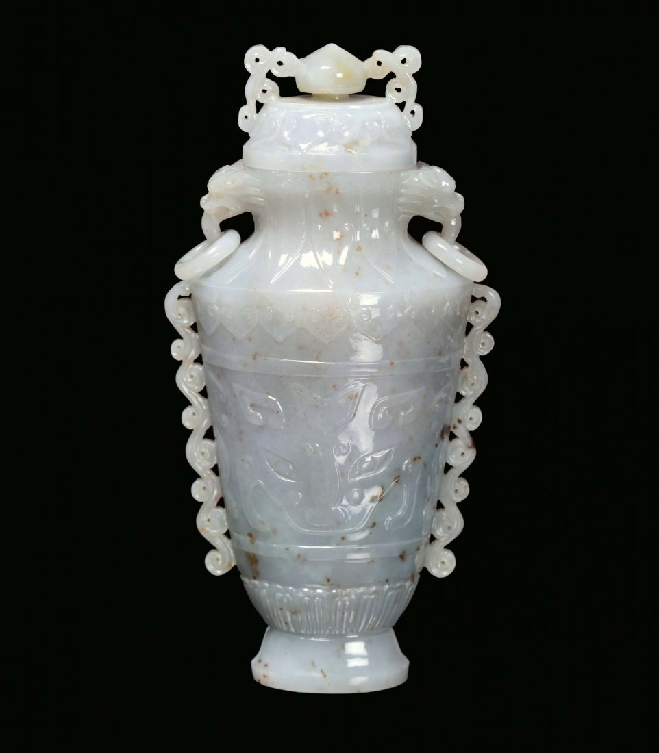 A Celadon green jade capped vase, Mogul taste with arch