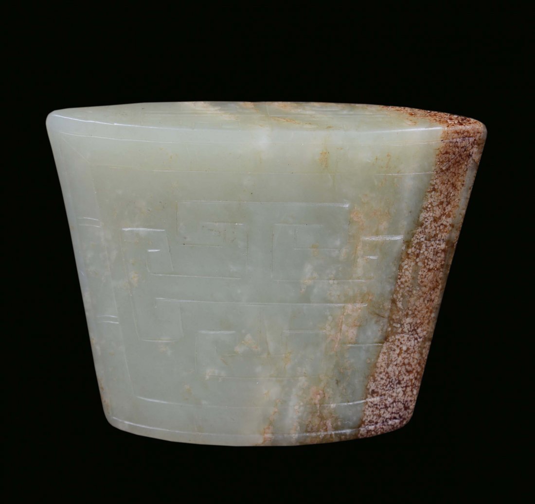 A Celadon white and russet jade, archaic shape, China, 