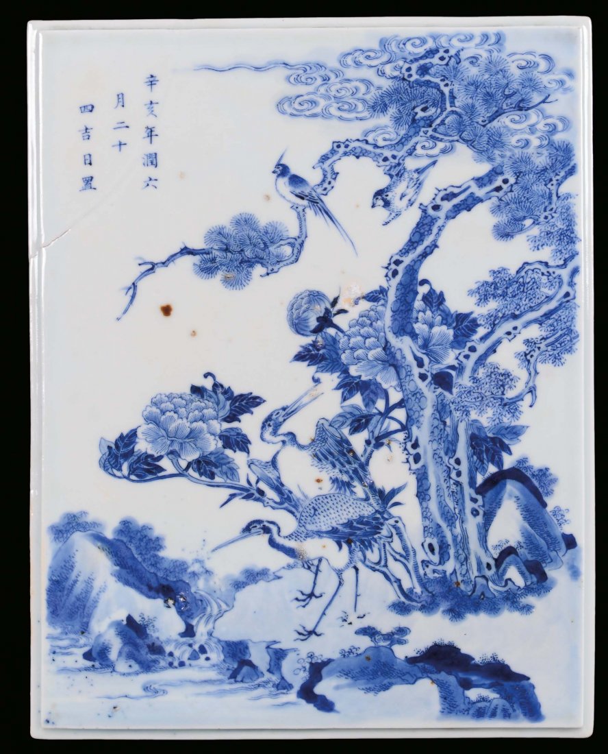 A white and blue porcelain plate decorated with natural