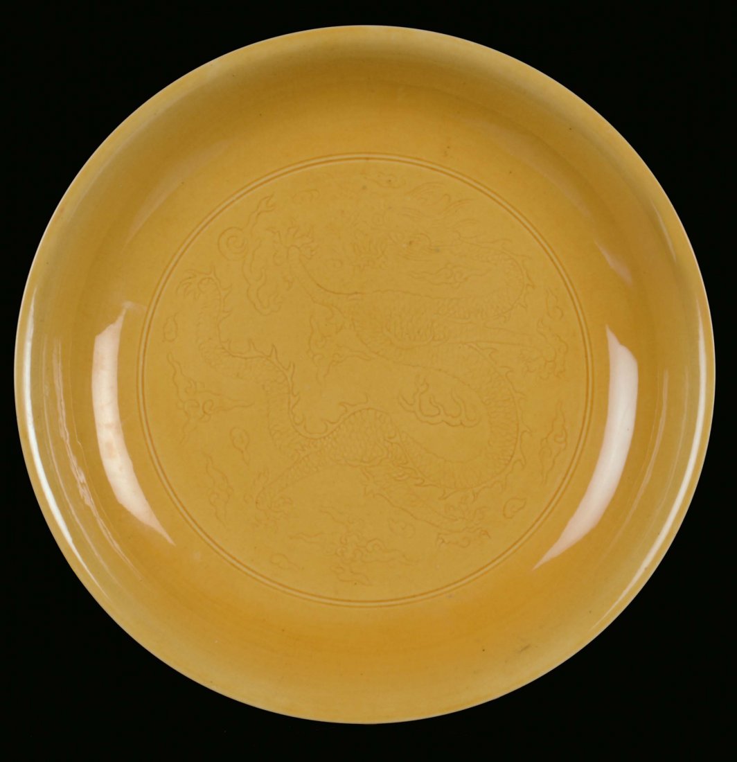 A monochrome porcelain plate, ochre tones, China, Qing 