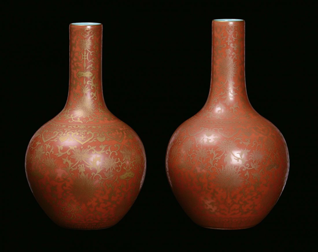 A pair of porcelain ampoule vases with orange backgroun