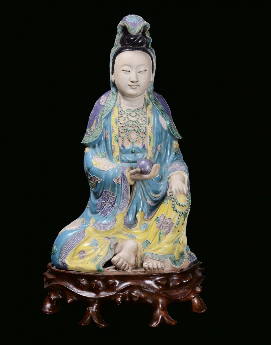 A large polychrome porcelain Guanyin in the colours of 