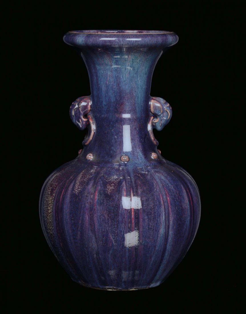 A flambÃ© ceramic vase in the shape of a pumpkin, China