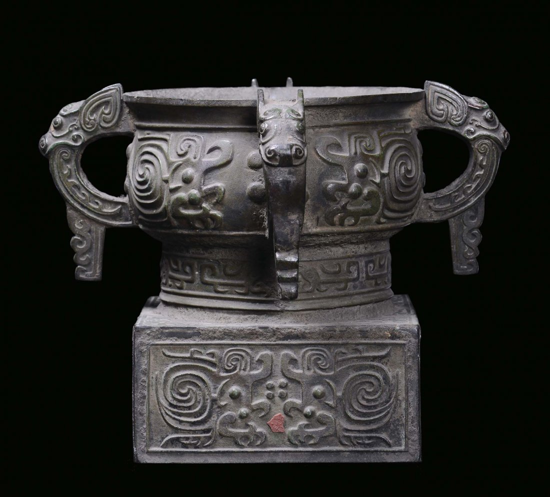 A bronze vase, archaic shape, with handles in the shape