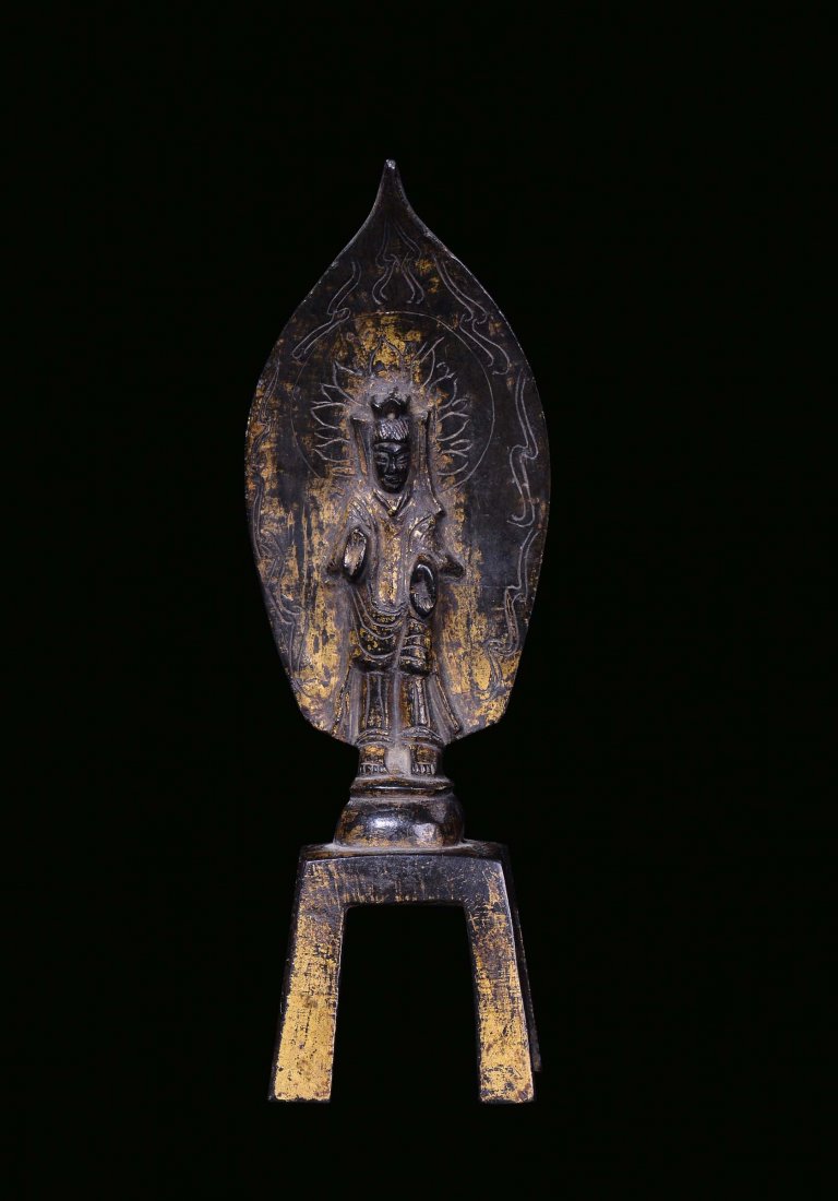 A small bronze archaic Buddha partially gilt, China, We