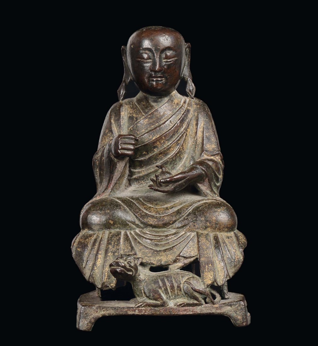 A rare Lohan figure with bronze dog, China, Ming Dynast