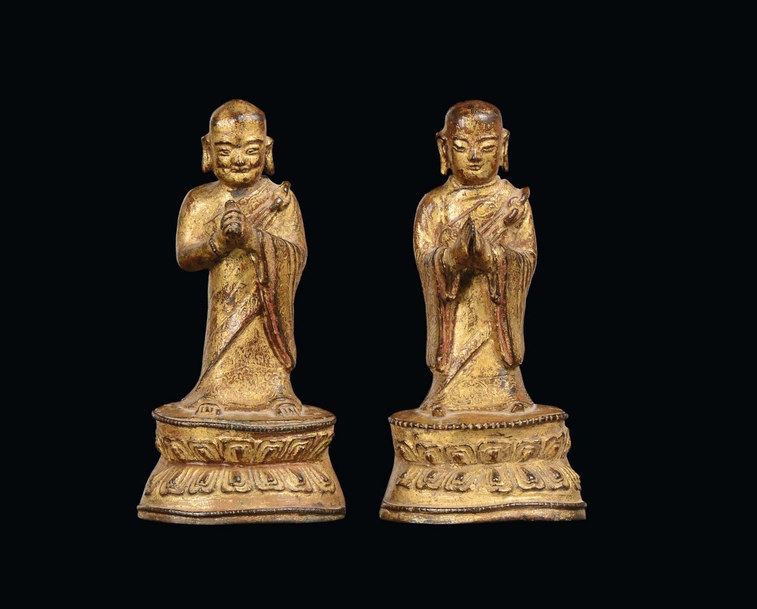 A pair of gilt bronze Lohan figures, China, Ming Dynast