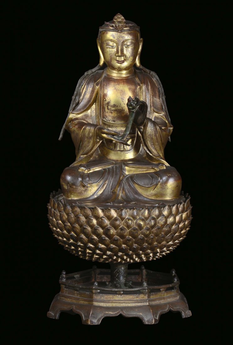 A large and important gilt bronze figure of Buddha on a
