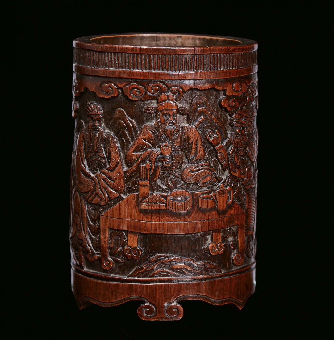 A bamboo wood brush holder finely carved with oriental