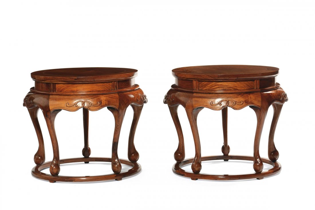 A pair of Huanghuali wood carved stools, China, 20th c: diam cm 69 e h cm 58