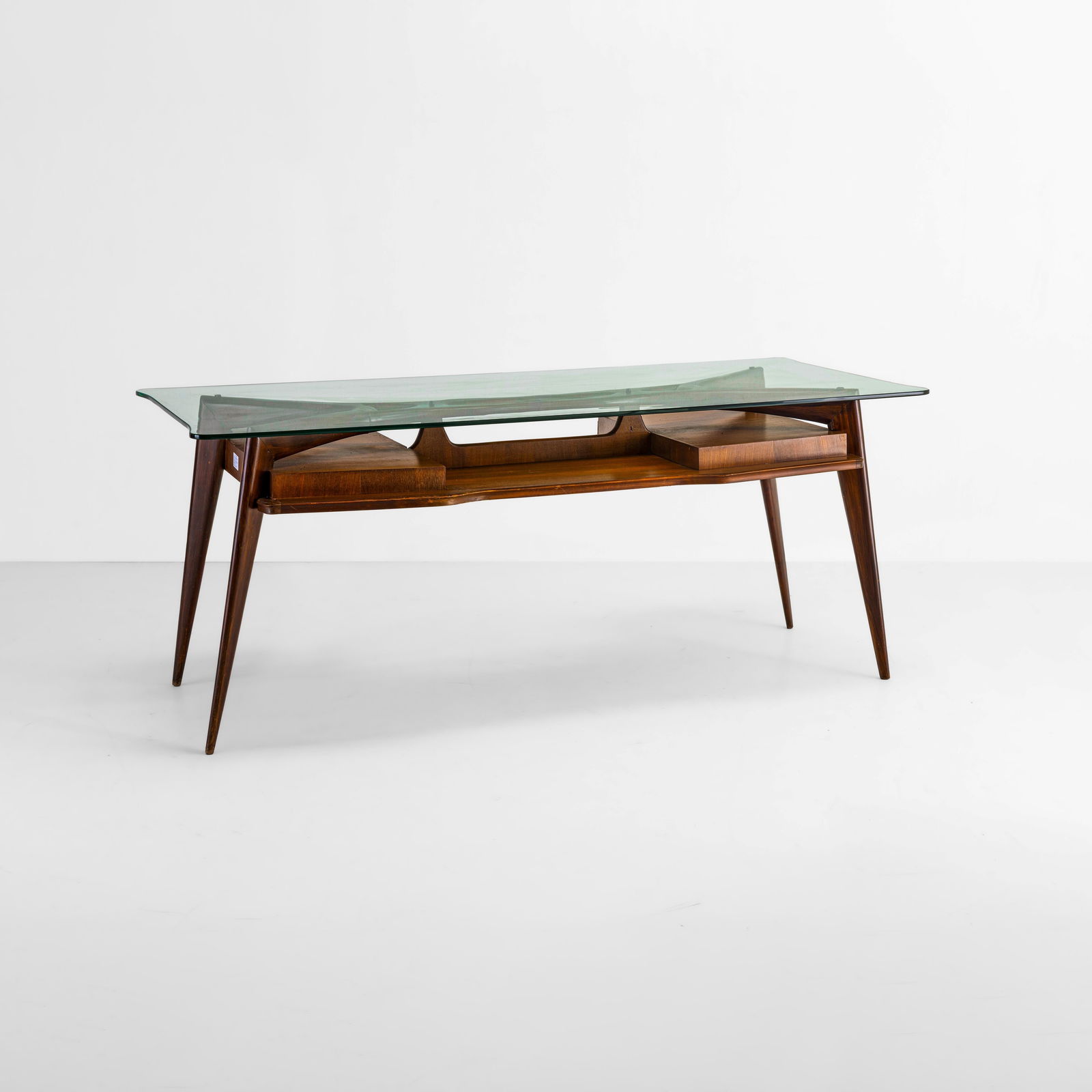 Scrivania: Struttura in legno, piano in cristallo molato. Prod. Italia, 1950 ca.