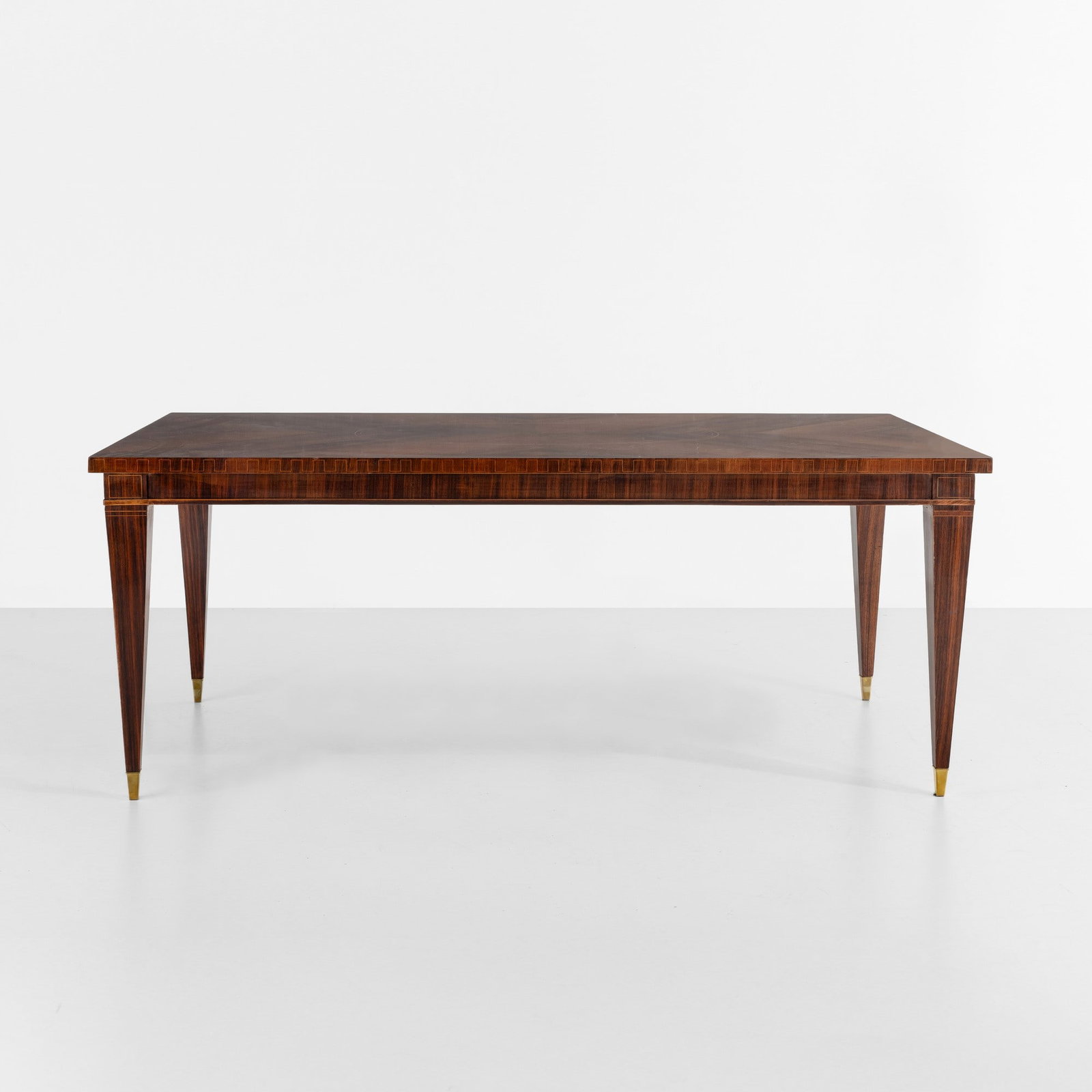 Paolo Buffa Tavolo: Struttura in legno e legno impiallacciato, puntali in ottone. Prod. Italia, 1940 ca. . Measuers: cm 196X98X78