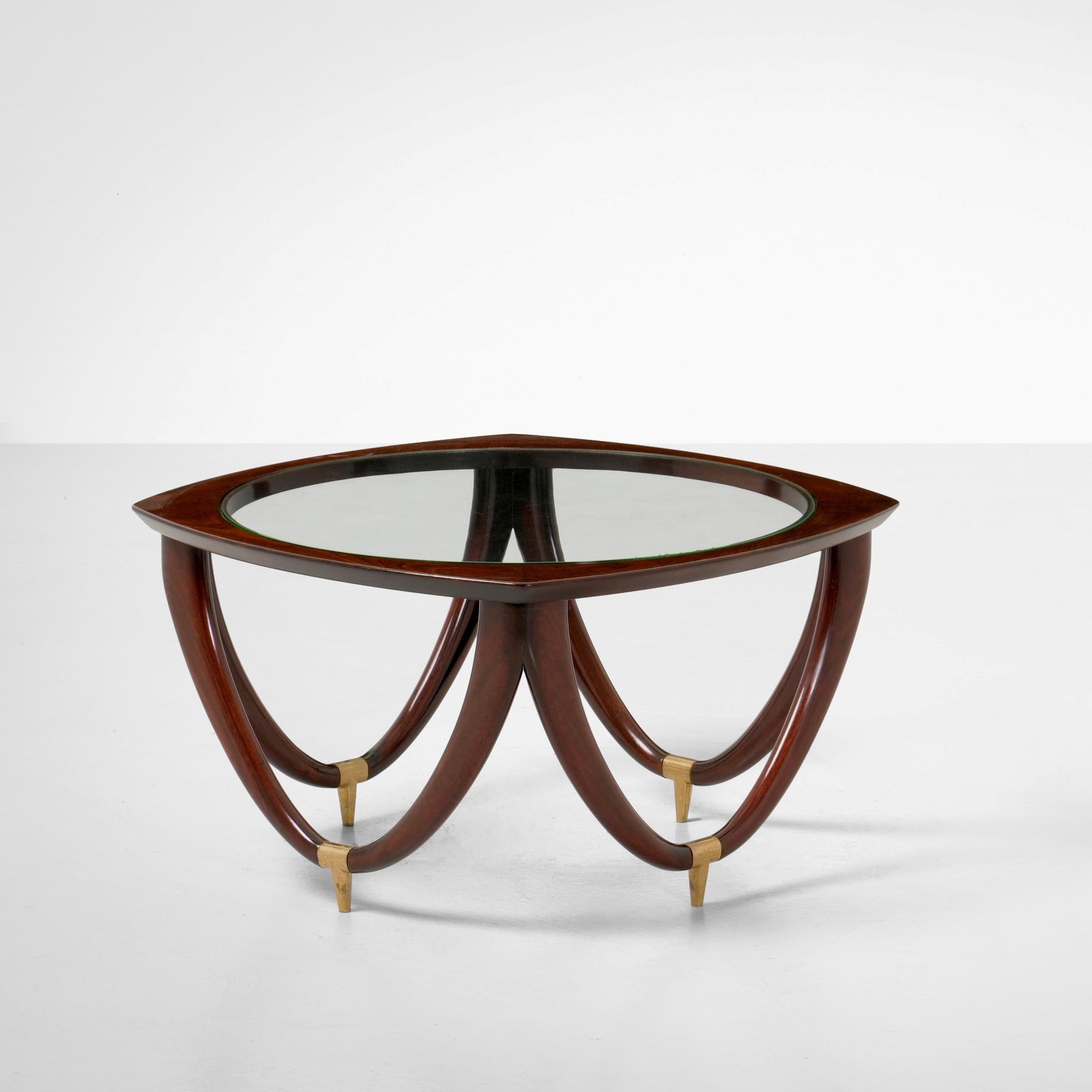 Melchiorre Bega Tavolo basso: Struttura in legno, piano in vetro e puntali in ottone. Prod. Italia, 1950 ca. . Measuers: W. 72 - H. 41,5 cm