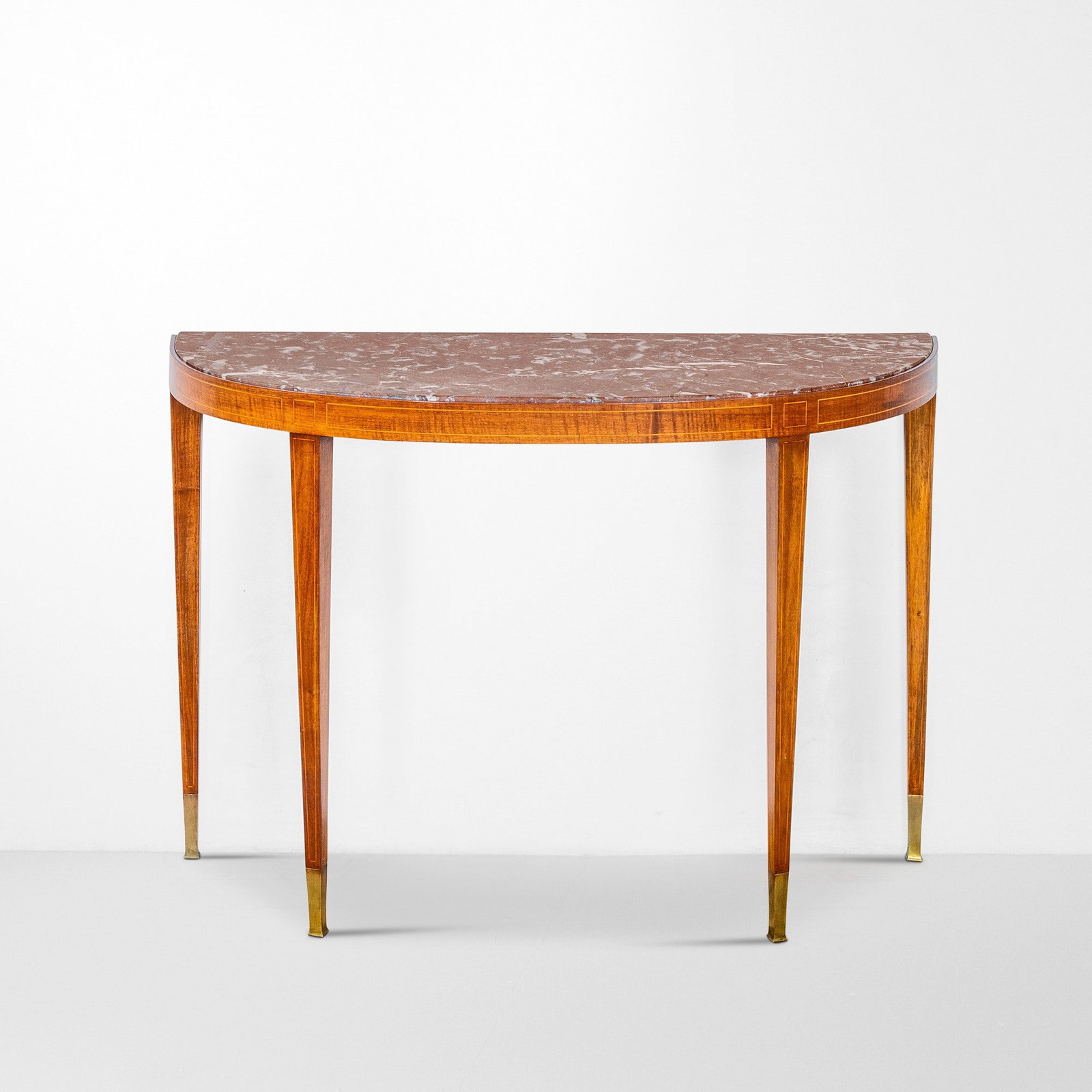 Paolo Buffa Console demi-lune da parete: Struttura in legno e dettagli in legno impiallacciato. Piano in marmo e puntali in ottone. Prod. Arrigihi Serafino, Italia, 1950 ca. . Measuers: W. 123 - D. 45 - H. 85 Cm