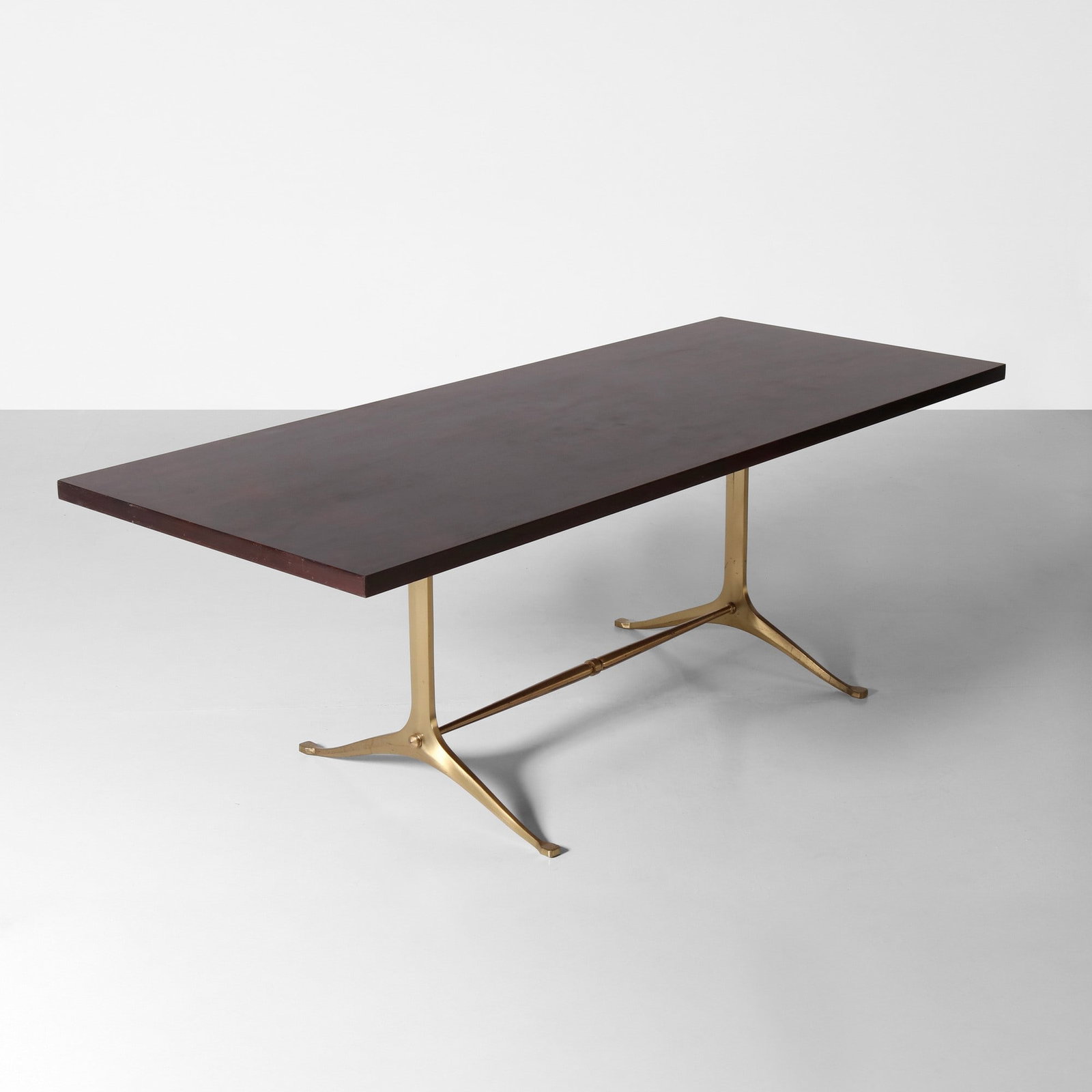Melchiorre Bega Tavolo: Struttura e sostegni in ottone, piano in legno. Prod. Italia, 1960 ca. . Measuers: W. 220 - D. 90 - H. 75 cm
