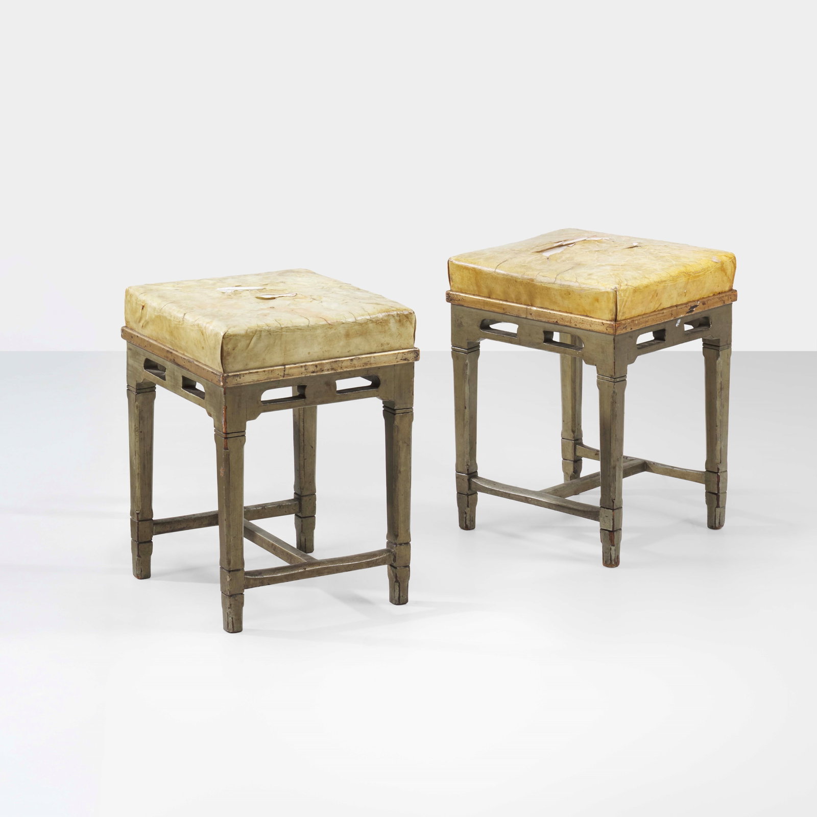Ernesto Basile Two benches: Painted wooden structure. Parchment upholstery. Italy, c. 1900. (similar model) E. Sessa, Mobili e Arredi di Ernesto Basile nella Produzione Ducrot, p. 108, Palermo, 1980 (modelli simili) G.