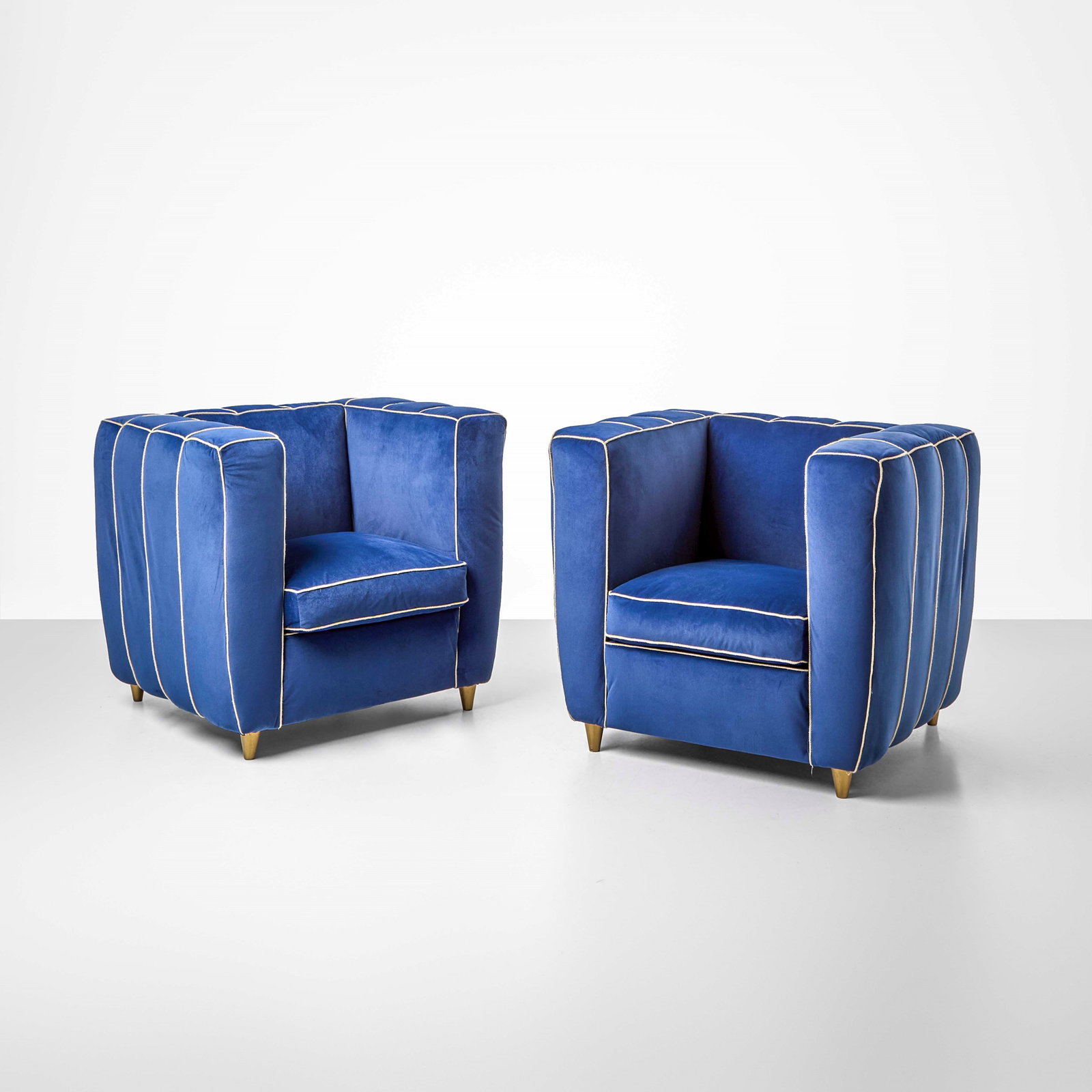 Guglielmo Ulrich Two armchairs: Wooden structure, fabric upholstery. Gold-lacquered wooden legs. Italy, c. 1940. (similar model) L. Sacchetti, Guglielmo Ulrich, p. 396, f. 236, Federico Motta Editore, 2009. . Measuers: W. 93 - D. 80