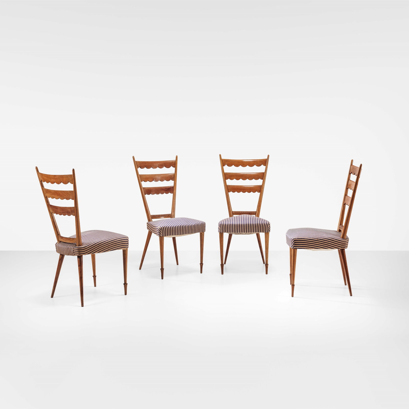 Paolo Buffa Four chairs: Wooden structure, fabric upholstery. Italy, c. 1950. (similar model) R. Rizzi, I mobili di Paolo Buffa, p. 16, Galleria del Design e dell?arredamento di Cant?, 2001. . Measuers: W. 46 - D. 46 - H.