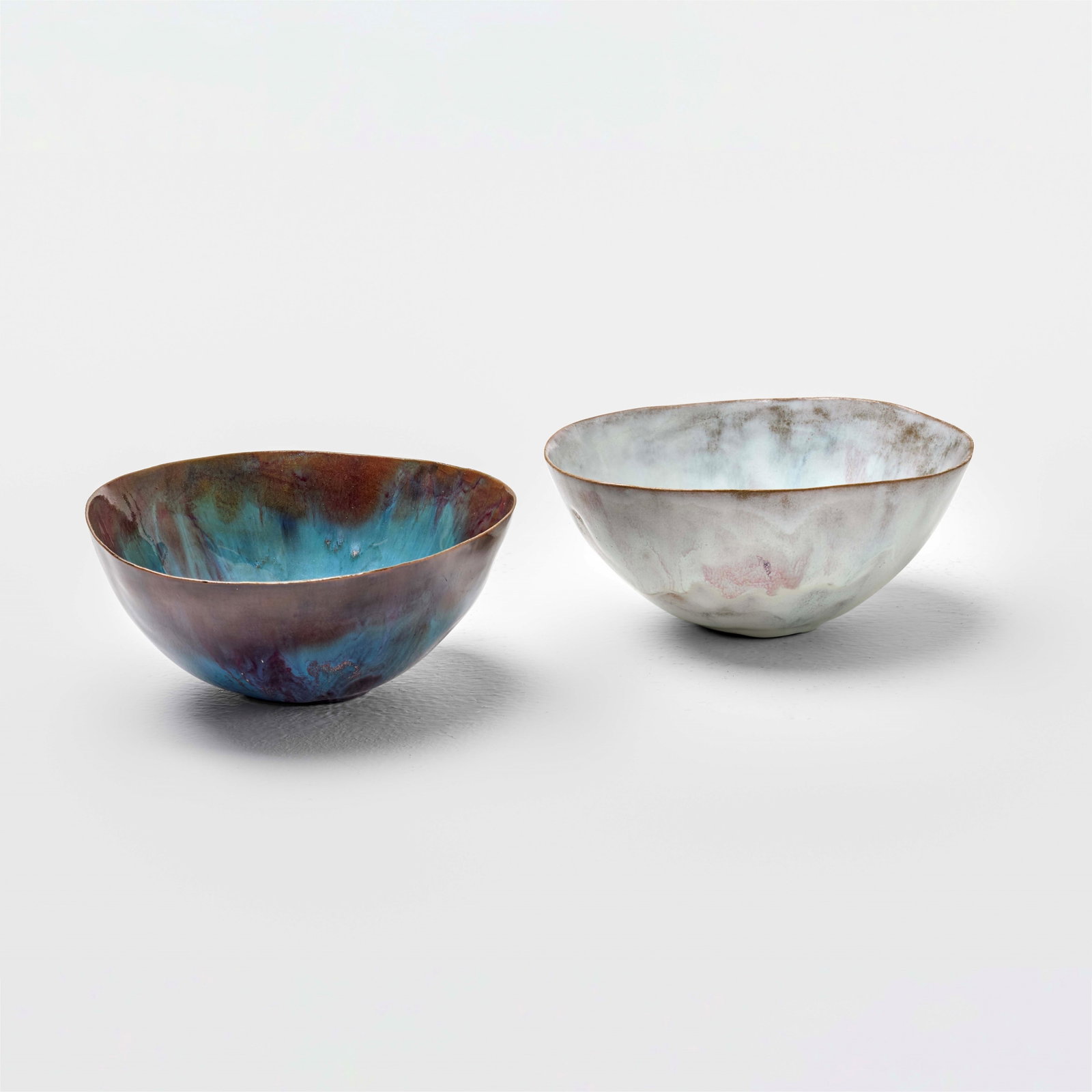Fausto Melotti Two cups: Polychrome glazed ceramic. Signed under the base. Melotti, Italy, c. 1950. . Measuers: cm 13.5x14x h 6 cm 14.5x13.5x h 6