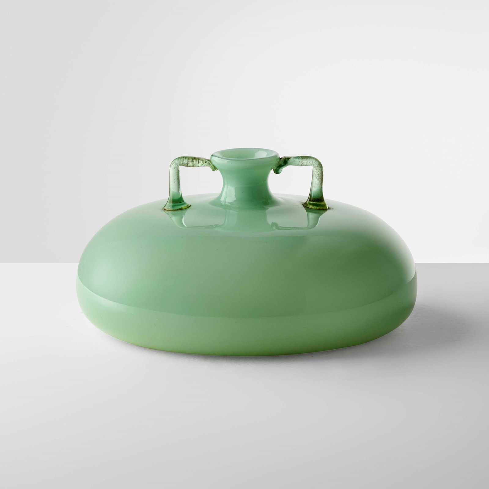 Vittorio Zecchin Vase mod. 5143 from the Incamiciati series.: Incamiciato white green vase. Coloured glass handles with gold applications. The vase was produced based on a model featured in the glassworks? catalog, designed by Vittorio Zecchin in 1923 and