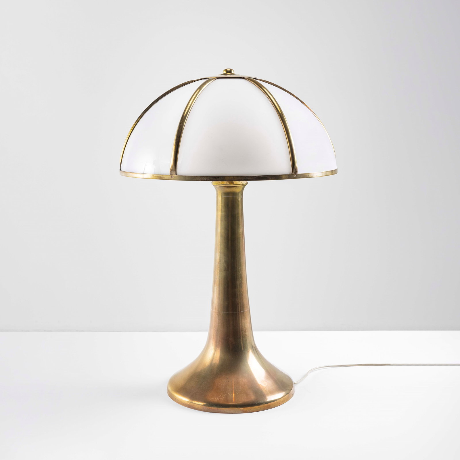 Gabriella Crespi Table lamp mod. Fungo from the Unicum series: Structure in brass, lampshade in brass and perspex. Engraved signature. Certificate of authenticity. Private collection - Milan. Crespi, Italy, 1970. . Measuers: Cm 45X70