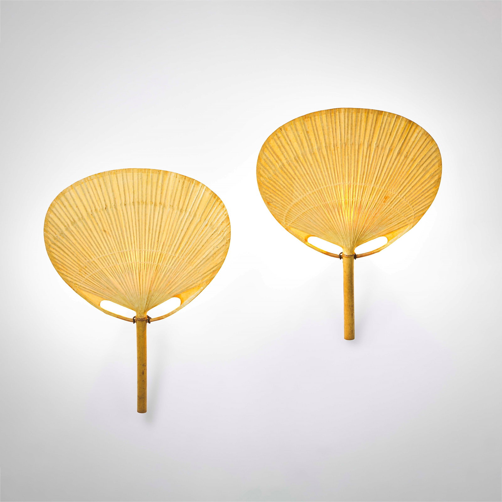 Ingo Maurer Two wall lamps mod. Uchiwa.: Structure in rice paper and bamboo. Details in metal, wood, and rope. Prod. Design M, Germany, 1973. B. Dessecker, F. Koschembar, K. Wengmann, Ingo Maurer: Designing With Light, p. 72, Prestel Pub,
