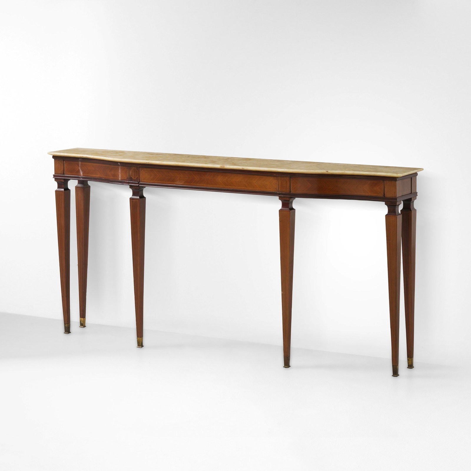 Console: Struttura in legno e legno impiallacciato con piano in onice. Puntali in ottone. Prod. Italia 1940 ca. . Measuers: cm 198X36X98