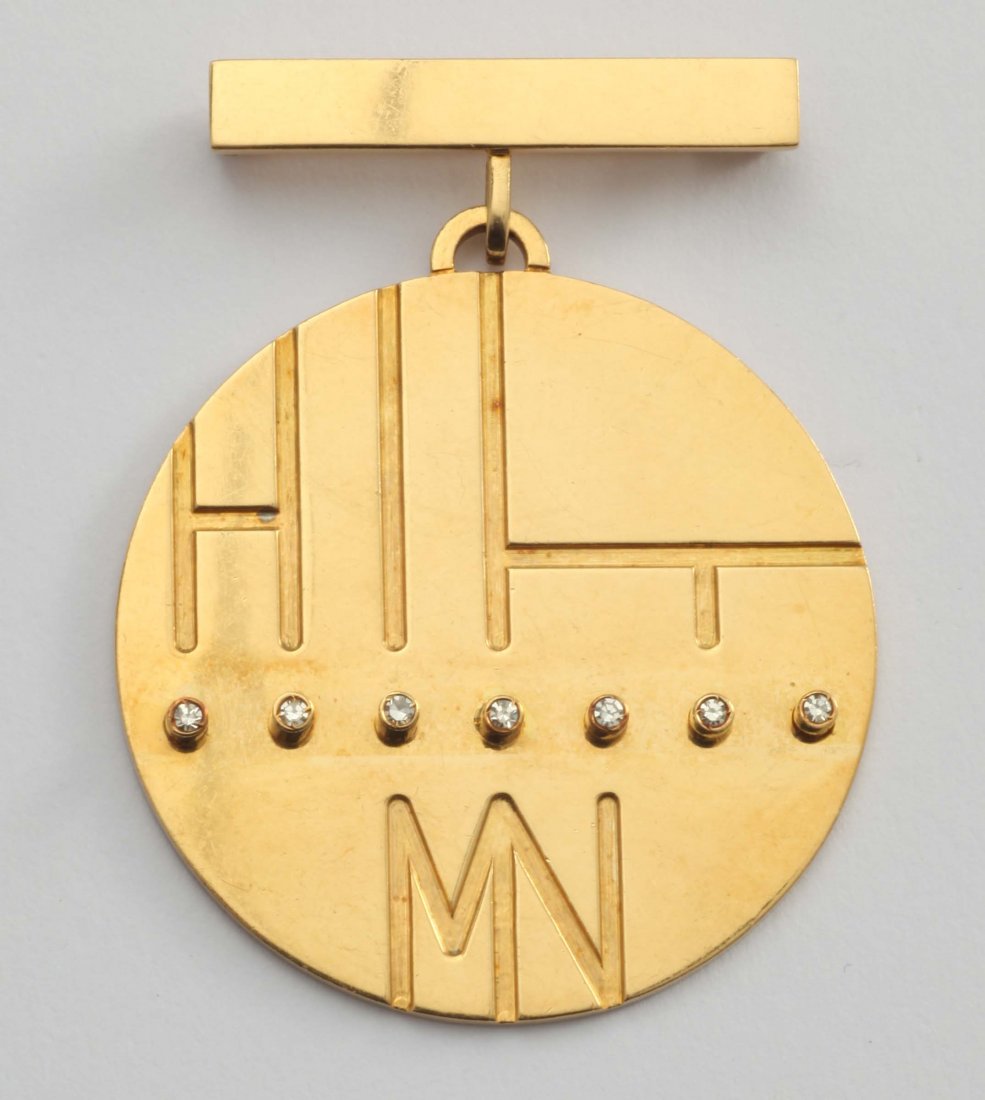 A diamond and gold brooch. Signed Gio Ponti: Gio Ponti spilla con diamanti in oro giallo 750/1000 “Montenapoleone Moda” 1968, dedicata a Lidia Tabacchi, siglata MNM