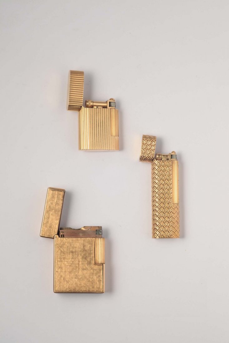 A three gold lighter boxes. By Van Cleef & Arpels and: oro giallo
