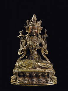 A large semi-gilt bronze figure of crowned Buddha on a: h cm 37