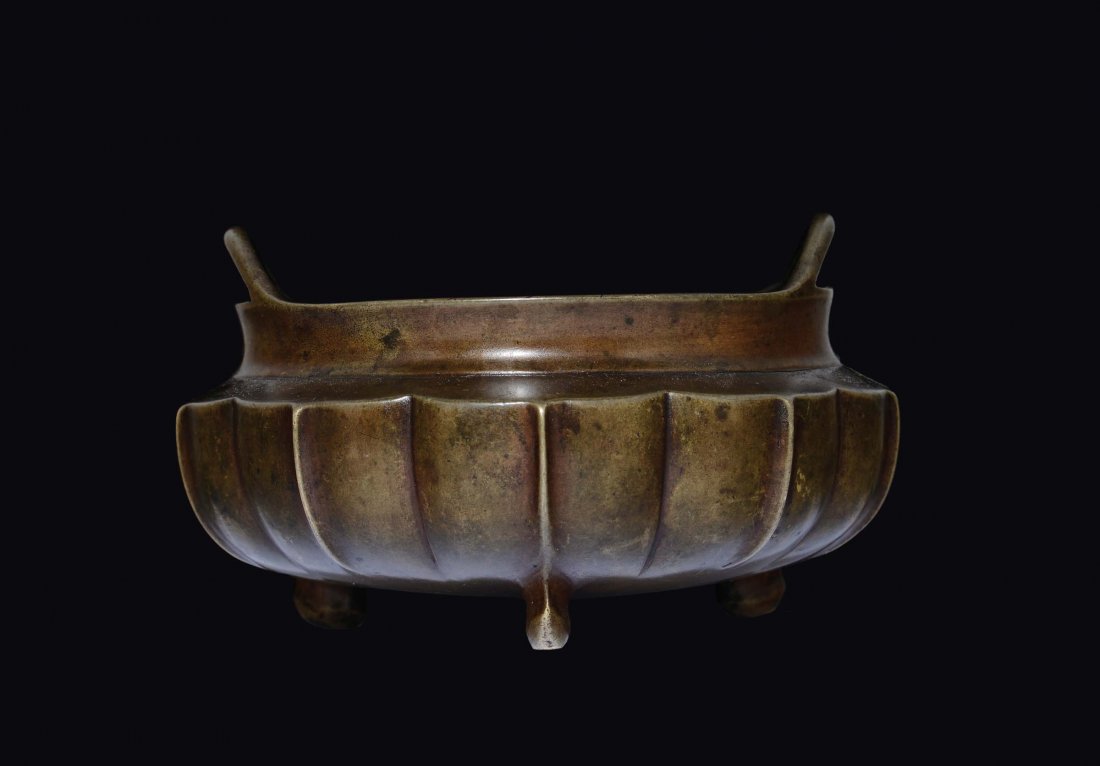 A tripod embossed bronze censer with handles, China, (1 of 2)