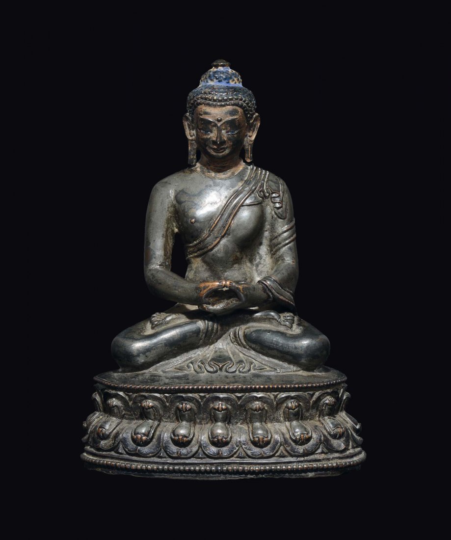 A silver-bronze figure of Sakyamuni Buddha, China, Ming (1 of 2)