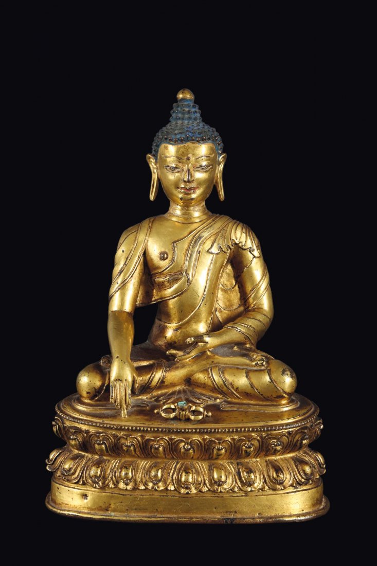 A gilt bronze figure of Sakyamuni Buddha with vajra on (1 of 2)