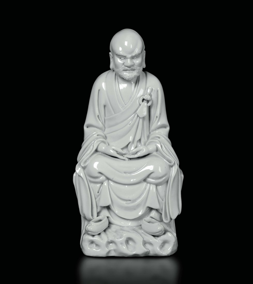 A Dehua figure of seated Guandi, China, Qing Dynasty, (1 of 3)