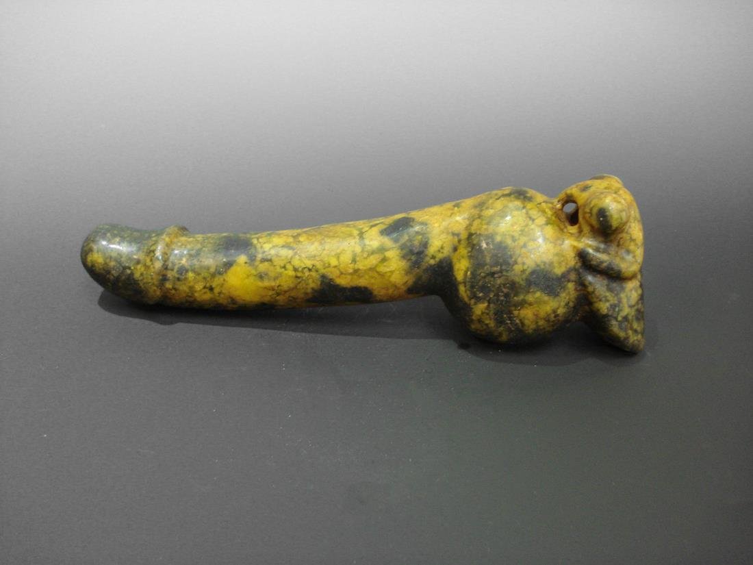 AN OLD JADE YELLOW MALE REPRODUCTIVE ORGAN: AN OLD JADE YELLOW MALE REPRODUCTIVE ORGAN. 11.75" L A yellow male reproductive organ appear to be healthy and is stongly pointing to a direction.