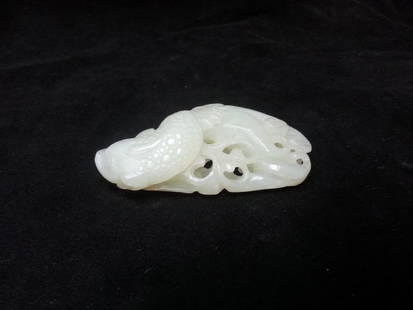 A HETIAN WHITE JADE STATUE: A very finely carved jade statue, small size. W 2.5" (TH)