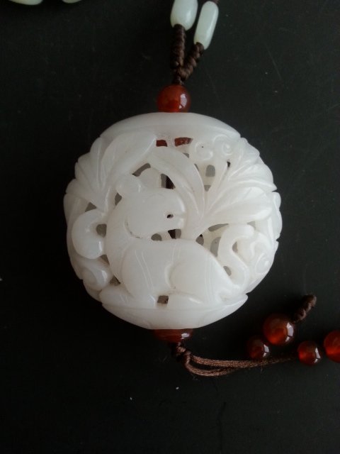 A CHINESE QING DYNASTY CARVED WHITE JADE?: A Chinese QING DYNASTY CARVED WHITE JADE， 19th C. Hollow out carve Exquisite workmanship, D 2" X D 2"