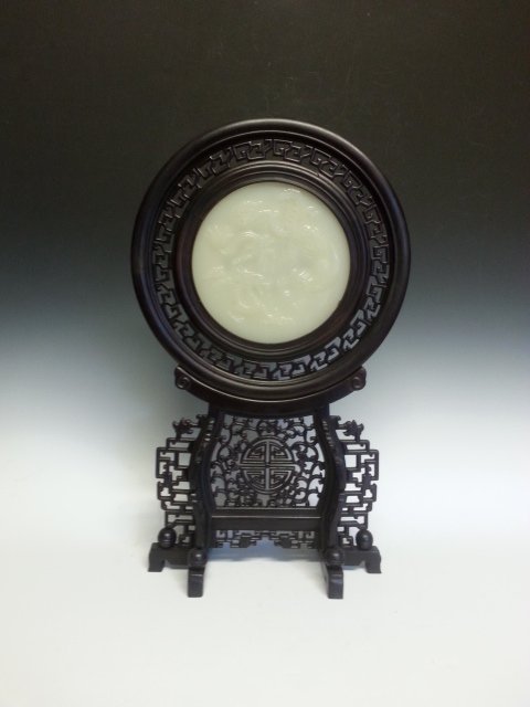 ANTIQUE CHINESE WHITE JADE TABLE SCREEN: Table screen with wooden frame and is of cirular shape. Dimension: 16" H
