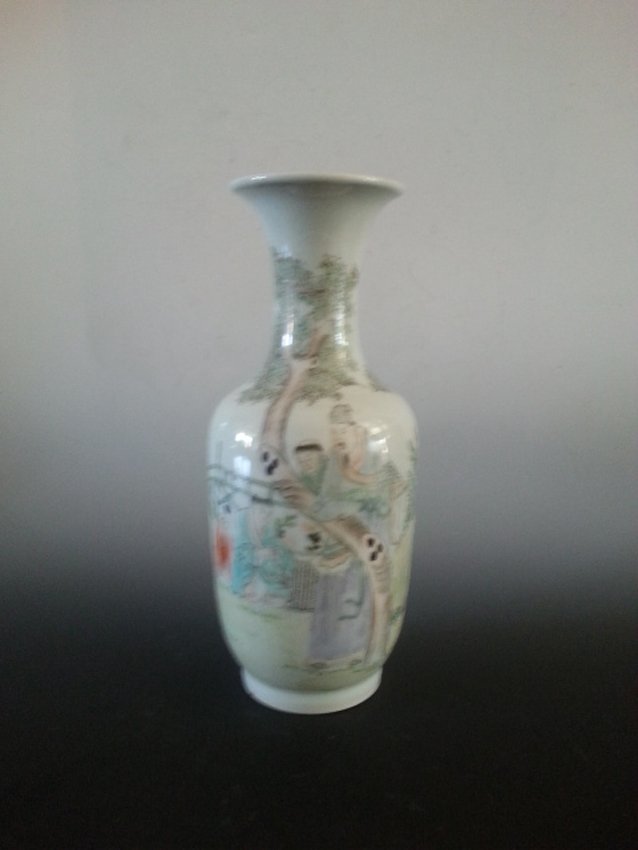 Porcelain citizens and natural view vase: A vase of standard shape with the top to be wide. A figure on the body showing a man standing next to a tree and two kids on the side looking happy. The other side of the body is a poetry with a mark 
