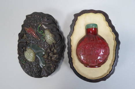 Chinese Carved Glass Snuff Bottle Carved Wood Box,: Chinese Carved Glass Snuff Bottle Carved Wood Box, the bottle an early well carved, heavily carved out 2 1/2" tall bottole with red to light cranberry with pinkish and purple hues, jade top, in a